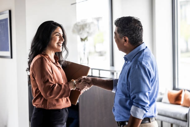 Hair salon owner shaking hands with an accountant